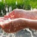 Hand collecting rainwater